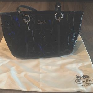 Black authentic Coach handbag. Zippered top